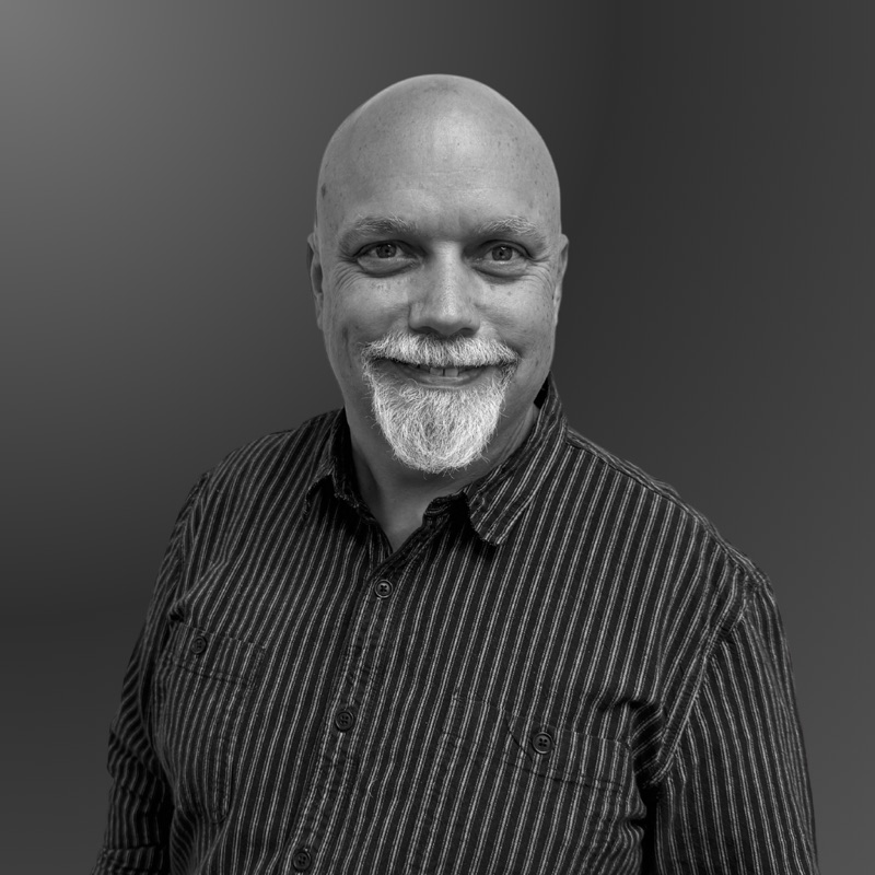 Black and white portrait of Matthew Greger