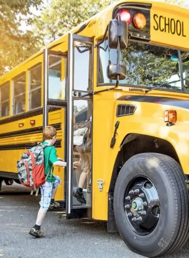 Child getting on a school bus