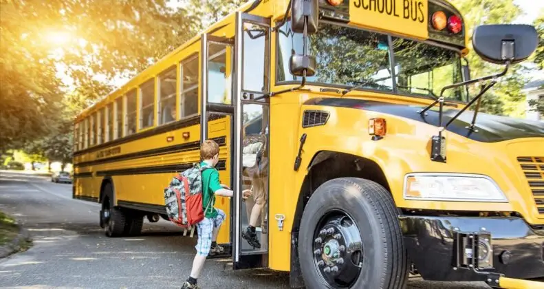 Child getting on a school bus