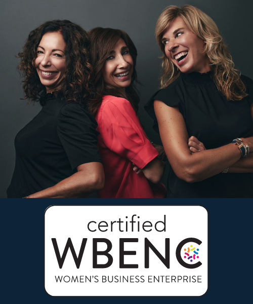 Nancy, Tricia, and Sofia posing with the WBENC logo