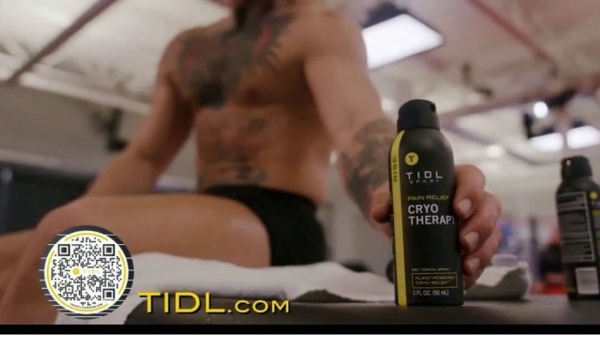 TIDL Pain Relief Cryotherapy Spray with QR code and Conor McGregor in the background